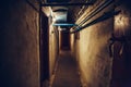 Long corridor or illuminated tunnel in bomb shelter, underground military bunker of cold war, perspective Royalty Free Stock Photo