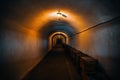 Long corridor or illuminated tunnel in bomb shelter, underground military bunker of cold war, perspective Royalty Free Stock Photo