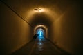 Long corridor or illuminated tunnel in bomb shelter, underground military bunker of cold war, perspective Royalty Free Stock Photo