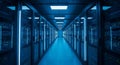Modern data center corridor with rows of illuminated server racks and blue lighting for high tech computing environment Royalty Free Stock Photo