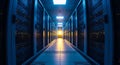 Modern data center corridor with rows of illuminated server racks and bright lighting for technology infrastructure Royalty Free Stock Photo