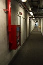 Long corridor interior and fire extinguish Royalty Free Stock Photo