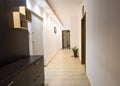 A long corridor with lights in an apartment. Entrance to the apartment Royalty Free Stock Photo