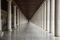 Long corridor between many columns Royalty Free Stock Photo