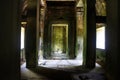 Long corridor of pillars in temple ruins. Angkor wat