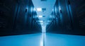 Modern data center server room with rows of blue lit high performance computing racks for cloud storage and network infrastructure Royalty Free Stock Photo