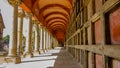 Long corridor with urns on the wall on a mysterious and sunny day in of the cemetery