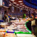 Long counter with various fish and shellfish in market. Barcelona.
