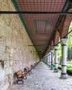 Long covered paved walkway with columns and benches, located in the courtyard of Topkapi Palace, Istanbul, Turkey