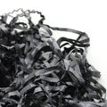 Long Crumpling Strips Of Black Paper On White Backdrop With Copy Space Royalty Free Stock Photo