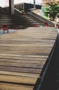 Long curvy wooden bench at Treu North Square in downtown Winnipeg, Manitoba, Canada