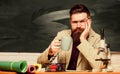 Long day at work. Handsome teacher relaxing. Teacher bearded man drinking tea chalkboard background. Relax concept Royalty Free Stock Photo