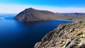 Lake Baikal, Bay, water, rocks, lichens, summer, sky, clouds, TazheLong bay beach with boats and farmhouses on a sunny summer day.