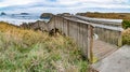 Long descending wooden stairway to public ocean beach Royalty Free Stock Photo