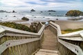 Long descending wooden stairway to public ocean beach Royalty Free Stock Photo