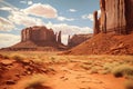 A long and desolate dirt road winds its way through the stark and arid wilderness of the desert, Navajo tribal park Monument Royalty Free Stock Photo