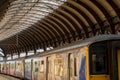 Long Diesel Train Stationary in York Railway Station.