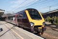 Long distance cross country train waiting at railway station platform