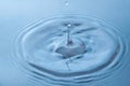 A long drop of water froze over the blue surface. Close-up Royalty Free Stock Photo