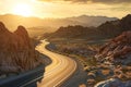 A long, dusty road cuts through the rugged desert landscape under a clear blue sky, A highway snaking through a rocky desert scape Royalty Free Stock Photo