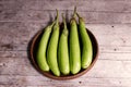 Long eggplants in the threshing basket Royalty Free Stock Photo