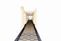 Long empty carpeted corrider in a building with white walls Royalty Free Stock Photo