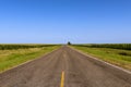 Long empty country road in rural Texas along cornfields Royalty Free Stock Photo