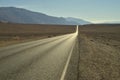 long empty desert road Death Valley National Park Royalty Free Stock Photo