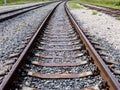 Long empty railroad tracks go into the distance, travel concept Royalty Free Stock Photo