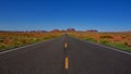 Long empty Road leading to Monument Valley landscape in Arizona USA