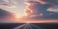 Long Empty Road Stretching Toward Horizon at Golden Sunset with Dramatic Clouds. Royalty Free Stock Photo