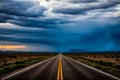 A long, empty Texas highway stretching through the desert with a dramatic sky overhead Royalty Free Stock Photo