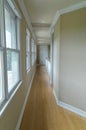 Long empty window lined corridor