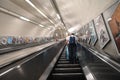 Long escalator in subway tube station Royalty Free Stock Photo