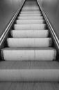 escalators inside mall with no people in black and white Royalty Free Stock Photo