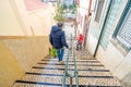 long escalators in the process of being hosed down on a street called Escadinhas da Saude Royalty Free Stock Photo