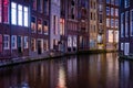 Long exposiure shot of a canal in Amsterdam, the Netherlands. beautiful and colorful lights during the night Royalty Free Stock Photo