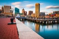 Long exposure of the Baltimore Skyline and Inner Harbor Promenade in Baltimore, Maryland.