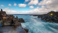 Long exposure of Biscoitos with volcanic rocks and tourists