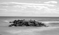 Long exposure black and white shoreline rocks Royalty Free Stock Photo