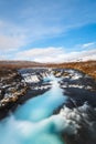 Long exposure of blue water at Bruarfoss waterfall