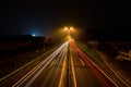 Long exposure of bright light lines on a highway at night Royalty Free Stock Photo