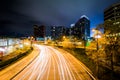 Long exposure of buildings and traffic on Light Street at night, in the Inner Harbor, Baltimore, Maryland. Royalty Free Stock Photo