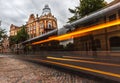 Long-exposure of bus with historical building. Royalty Free Stock Photo