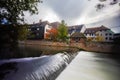 Long exposure capture of the weir near the Heubruecke or Heu Bridge on the Pegnitz River in the old City of Nuremberg. Pedestrian