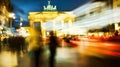 A long exposure captures the light trail with motion blur at the Brandenburg Gate during sunset. Royalty Free Stock Photo