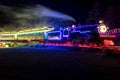 Long exposure of a christmas tree lighted steam engine train at night