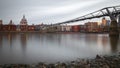 Long exposure, Millennium bridge and St Paul`s cathedral in London Royalty Free Stock Photo