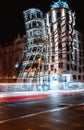 Long exposure of cityscape Prague with lights trails surrounded by buildings