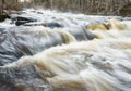 Long exposure closeup of a small gushing waterfall in a forest Royalty Free Stock Photo